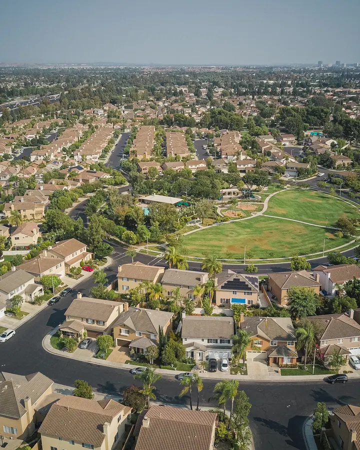 Refrigerator repair in Casa de Oro-Mount Helix, CA Drone view of a roomy residential area with many homes, similar to the hillside neighborhoods of Mount Helix