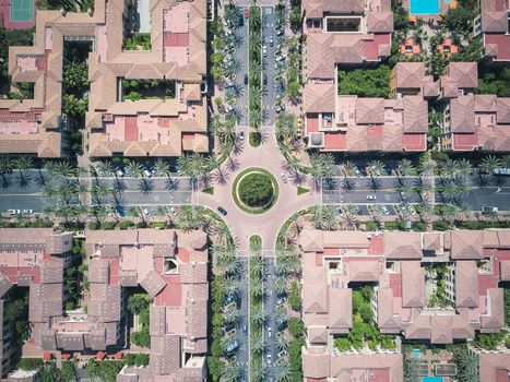 A top-down view of urban architecture featuring roads, buildings, and a roundabout.