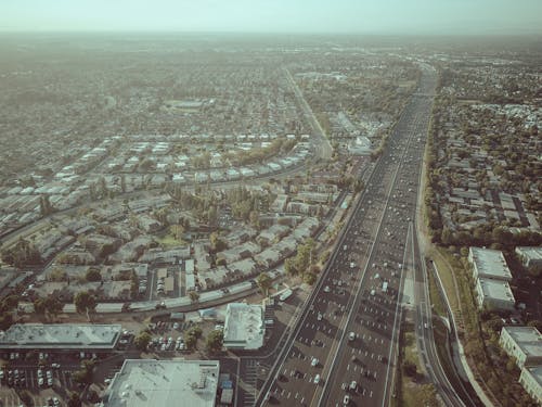 Aerial Photography of Buildings and Houses Near Freeway