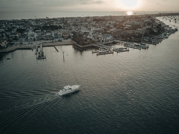 Aerial View Of City Near Boating Docks At Sunset