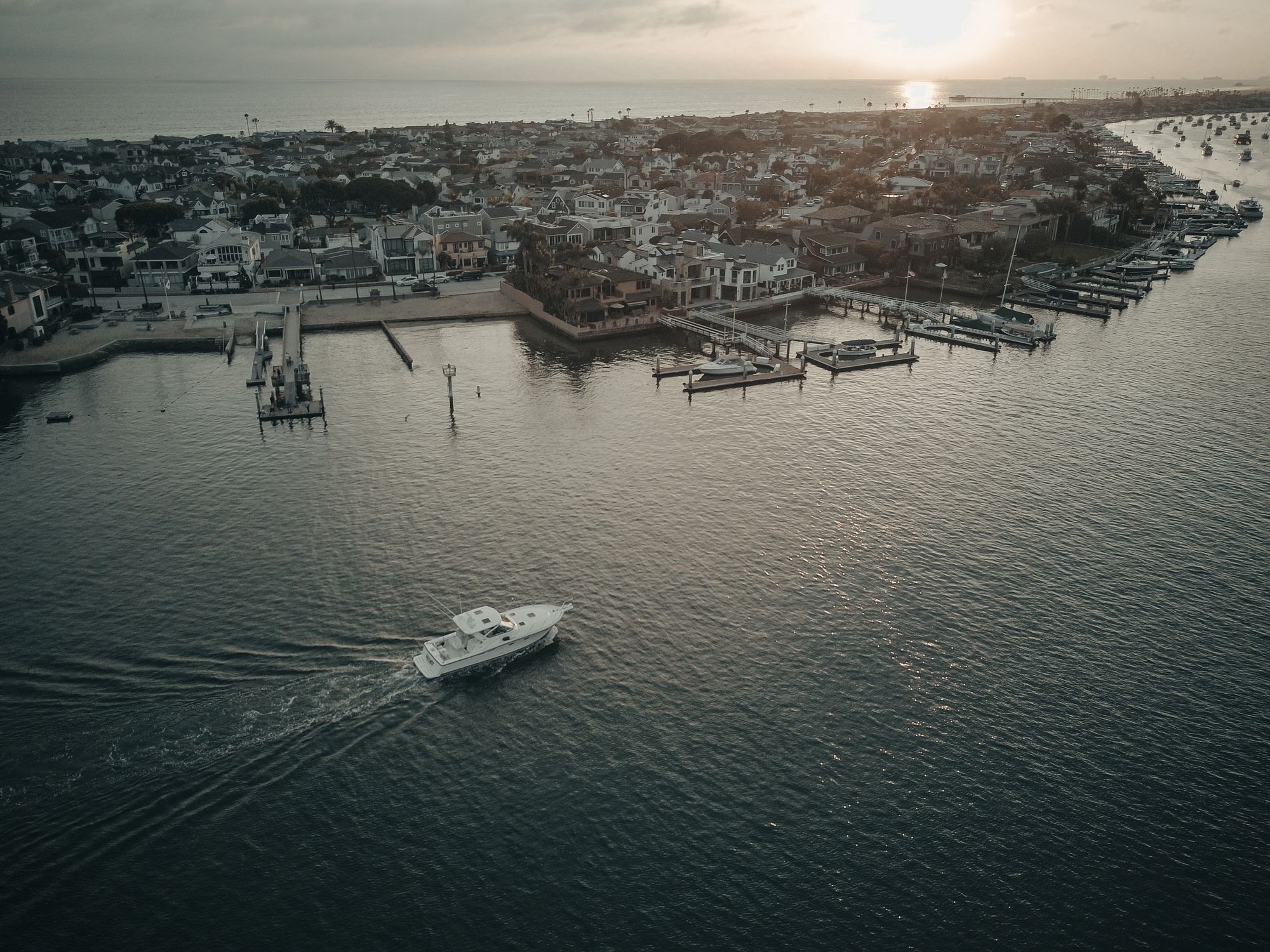 Aerial View of City Near Boating Docks at Sunset · Free Stock Photo