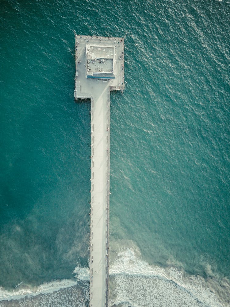 Aerial View Of Concrete Jetty In Turquoise Water