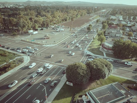 An aerial view showcasing a busy intersection in an urban area with heavy traffic.