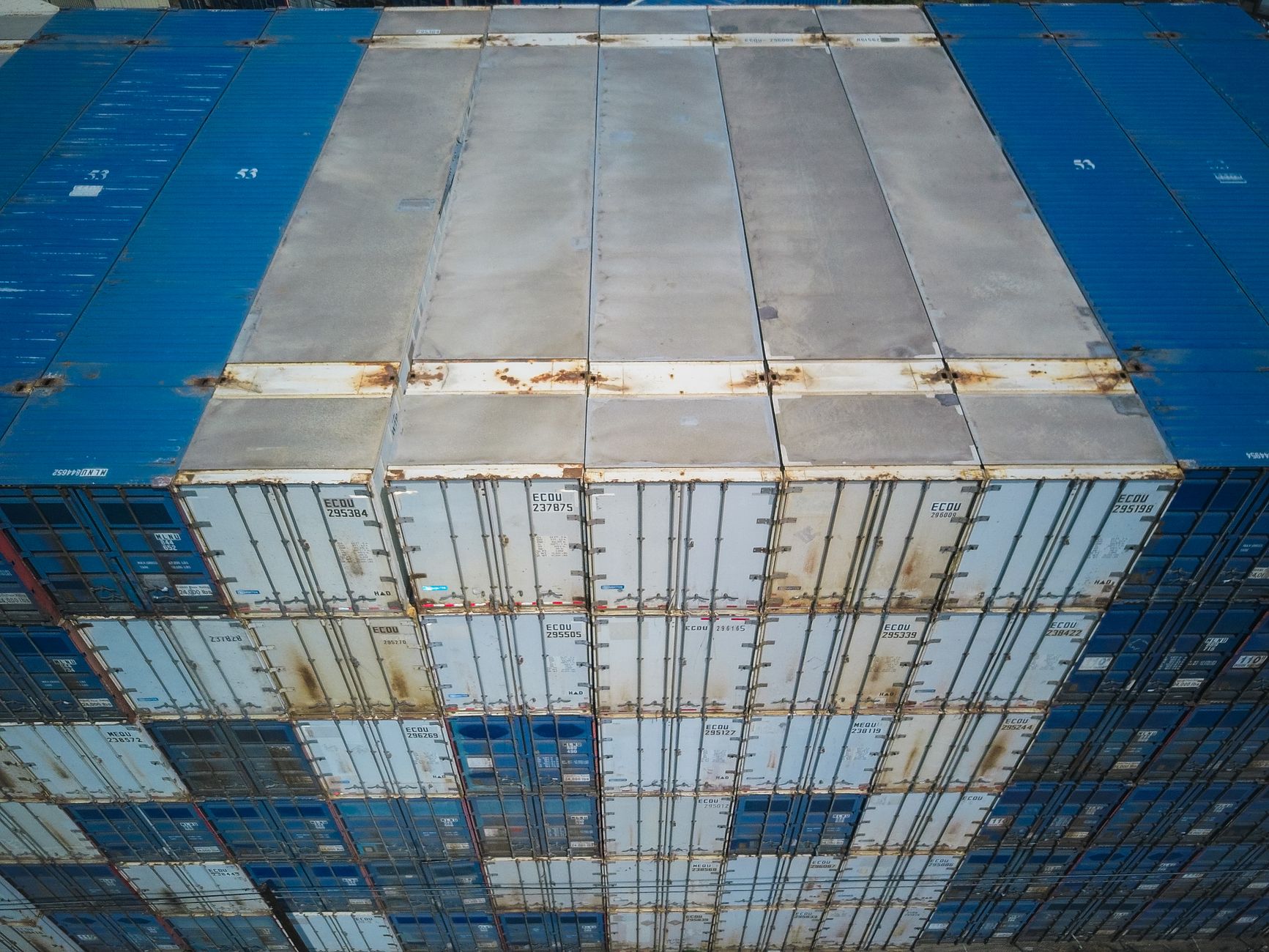 Shipping container yard aerial view of stacked containers
