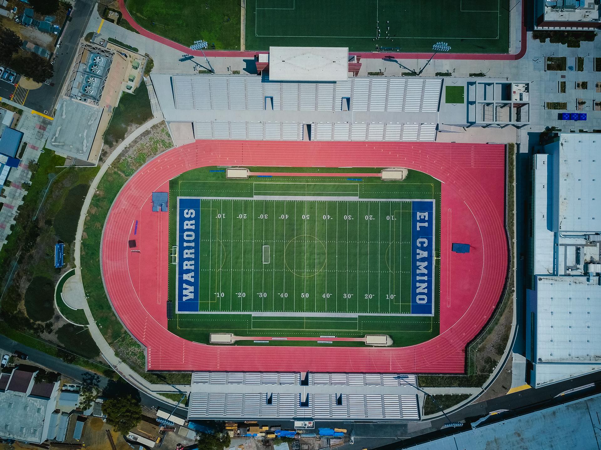 Aerial View of Football Stadium Near Buildings