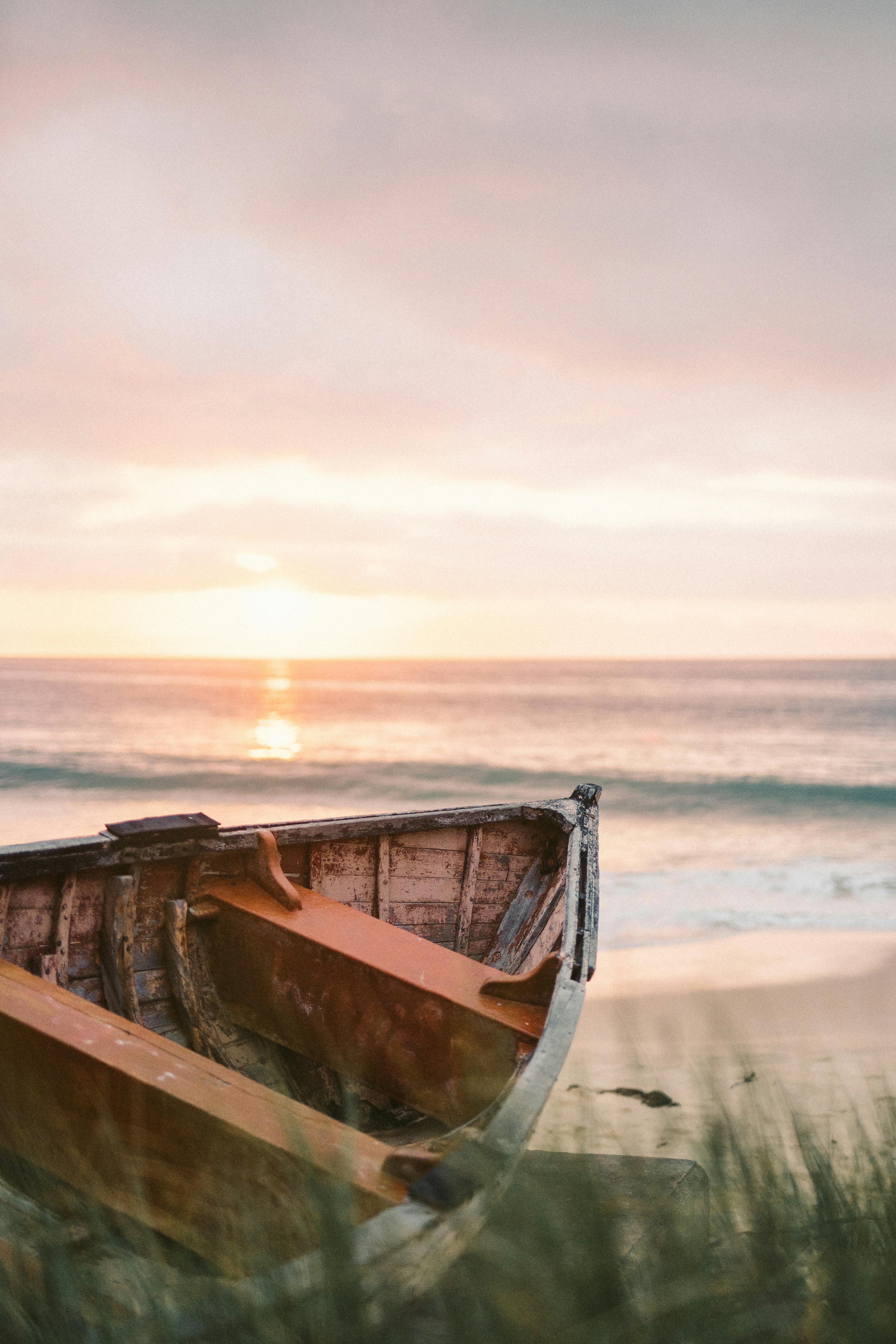 wooden boat on seashore