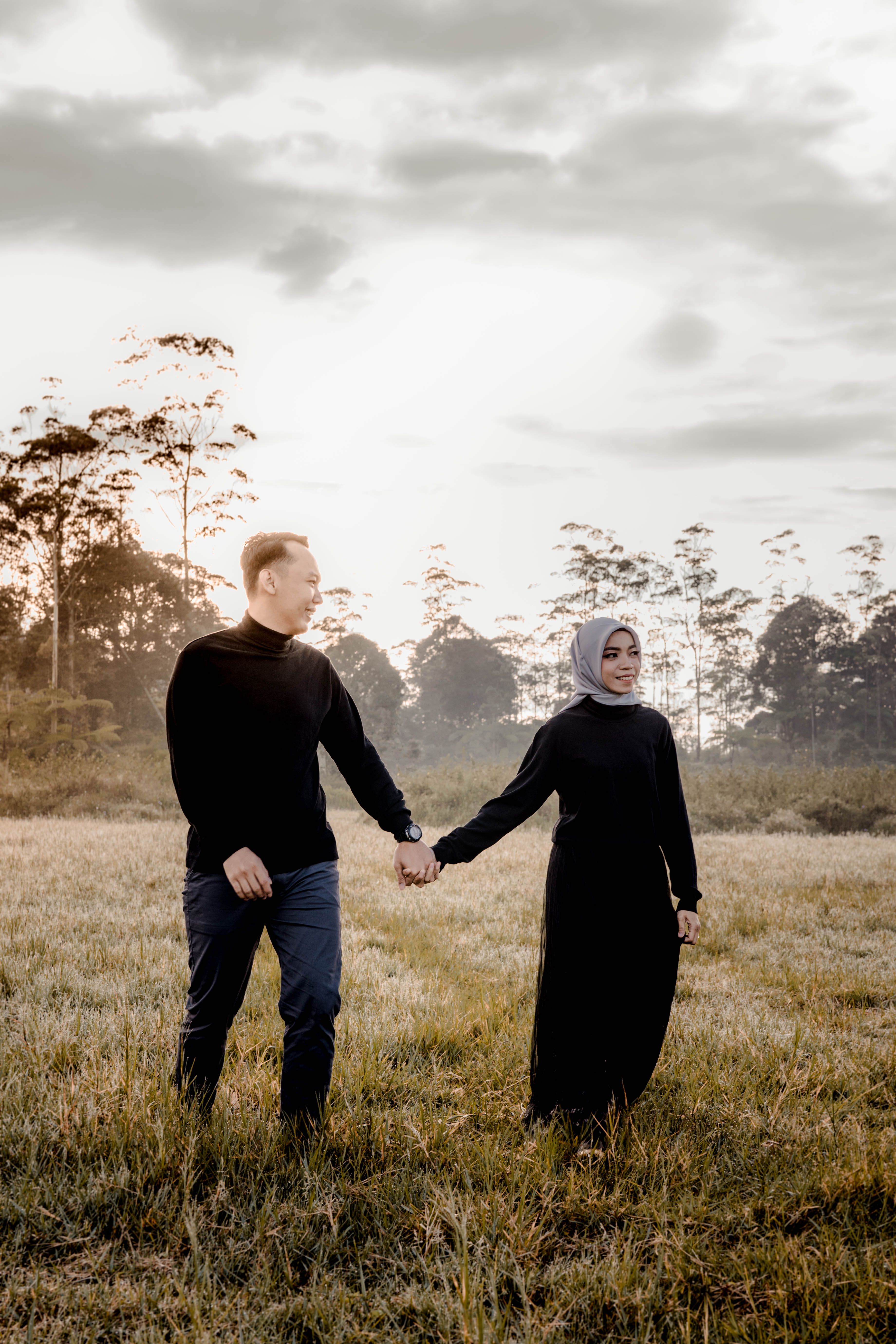 Couple Walking on Grass Field Holding Hands · Free Stock Photo