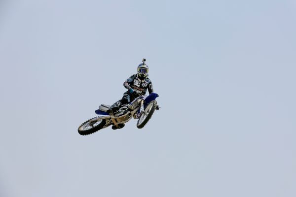 Motocross rider performing a mid-air stunt, Brian Muchemwa on Pexels