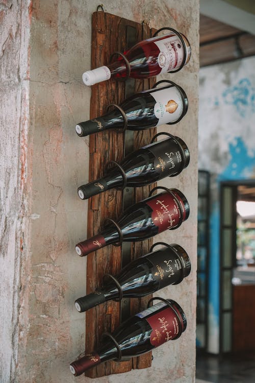 Free Wooden Wine Rack Hanging on the Wall  Stock Photo