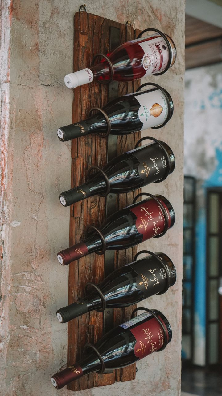 Wooden wine rack repurposed as mug storage for a dollar tree coffee bar design