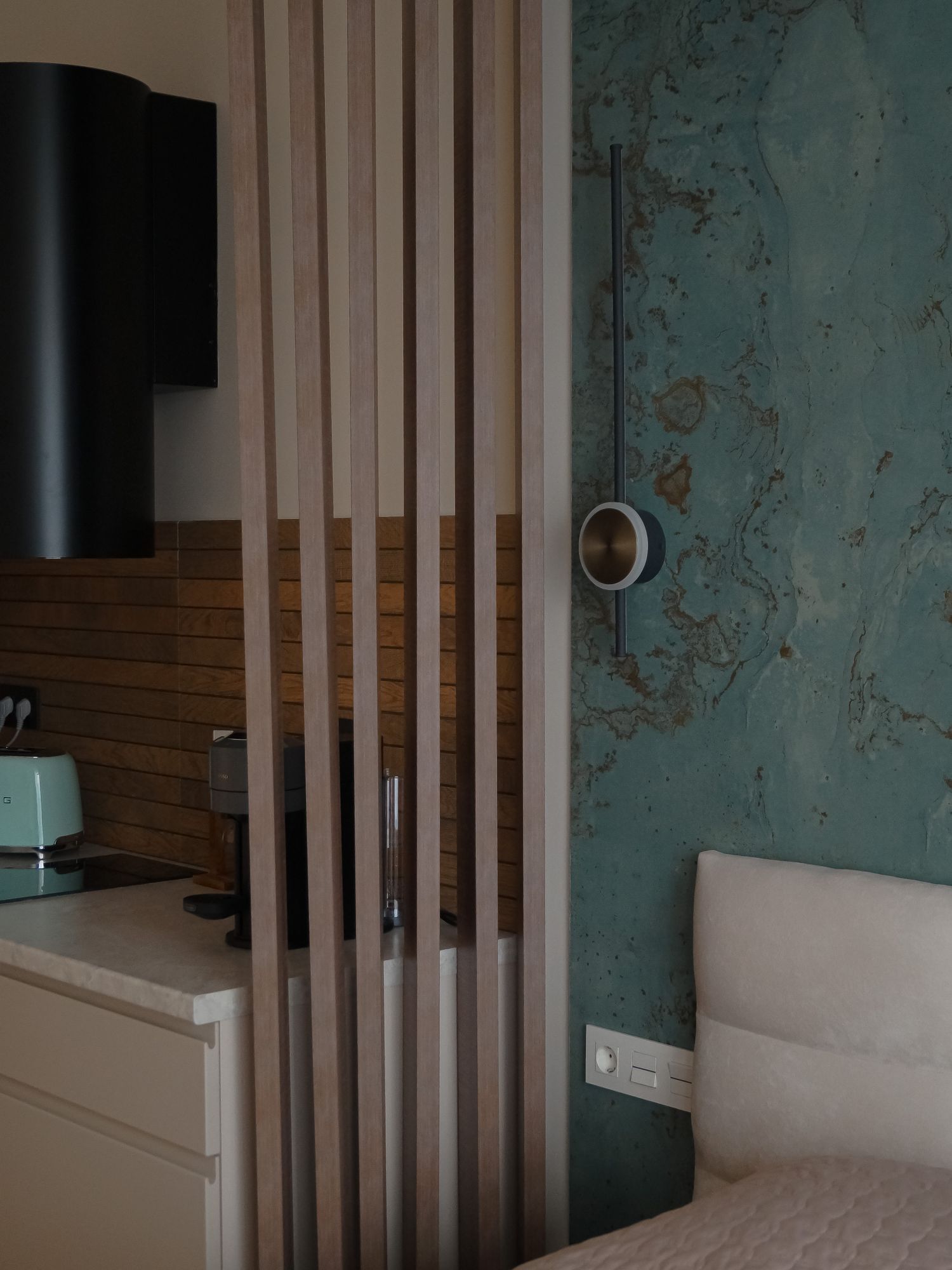 Minimalist kitchen and dining zone with architectural lighting