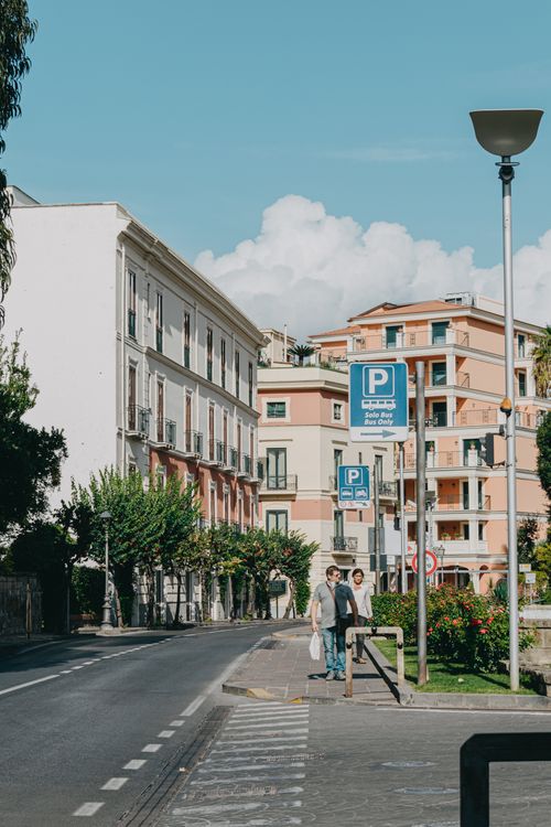 Free Scenic street view in Sorrento, Italy featuring urban architecture and lush greenery. Stock Photo
