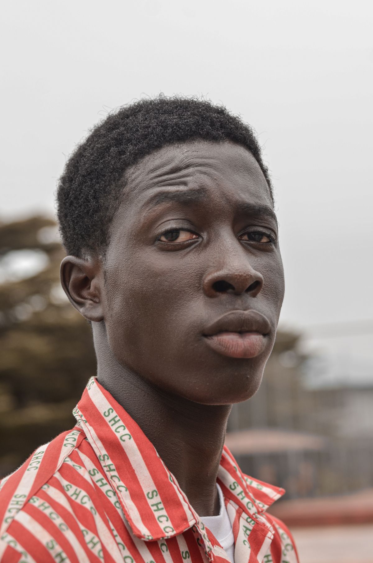 Close-up portrait of a young African man with a serious, contemplative expression