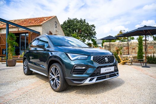 A sleek SEAT Ateca SUV parked in a sunny Madrid setting, showcasing modern automotive design.