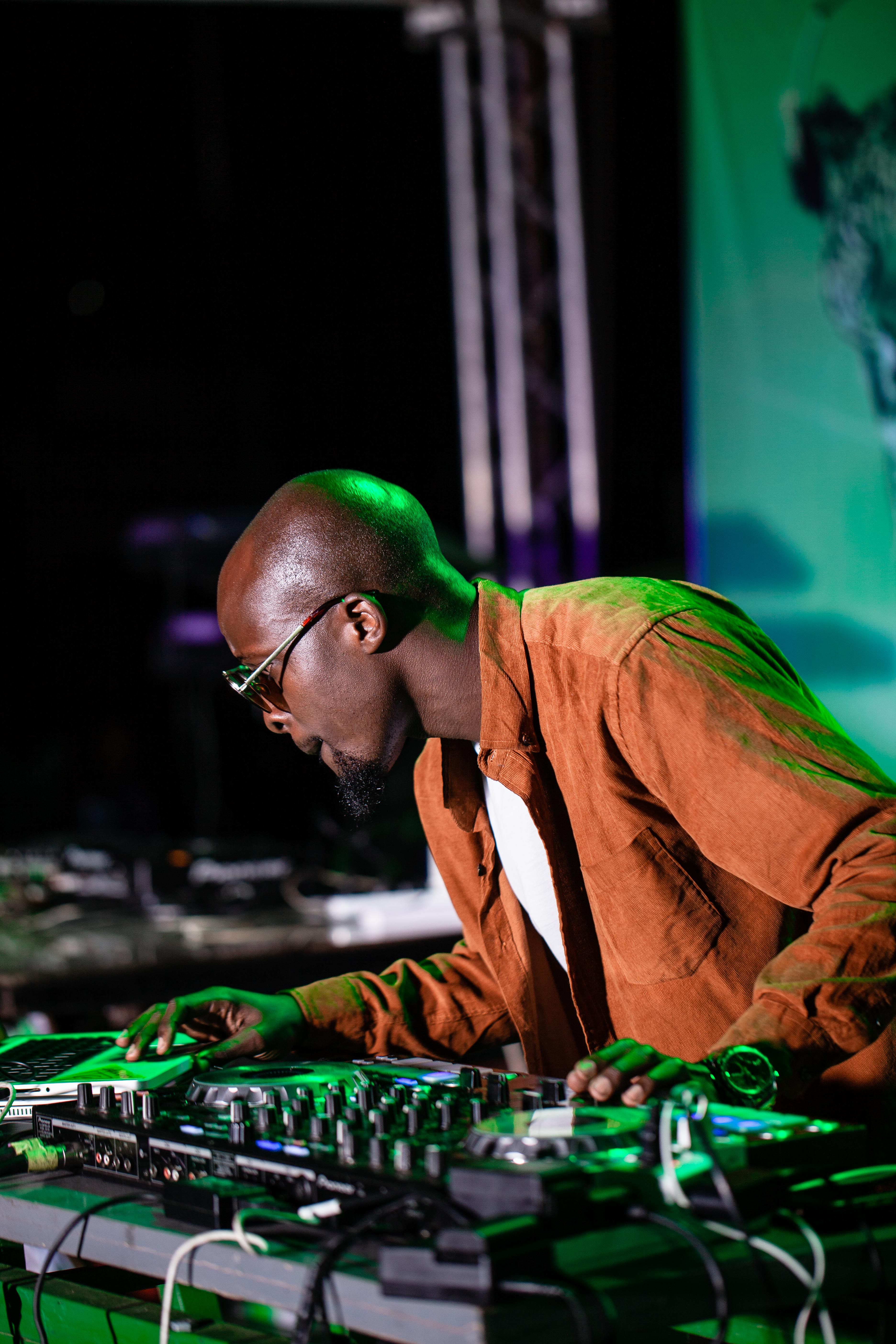 A DJ mixing at a night event
