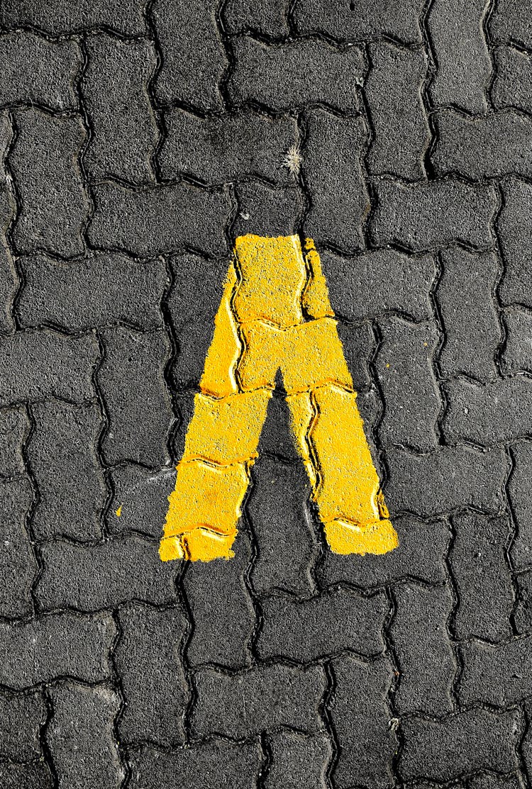 Yellow Sign On A Clay Pavers