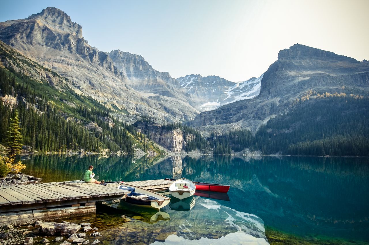 tranquil lake o hara with boats and mountains in british columbia perf