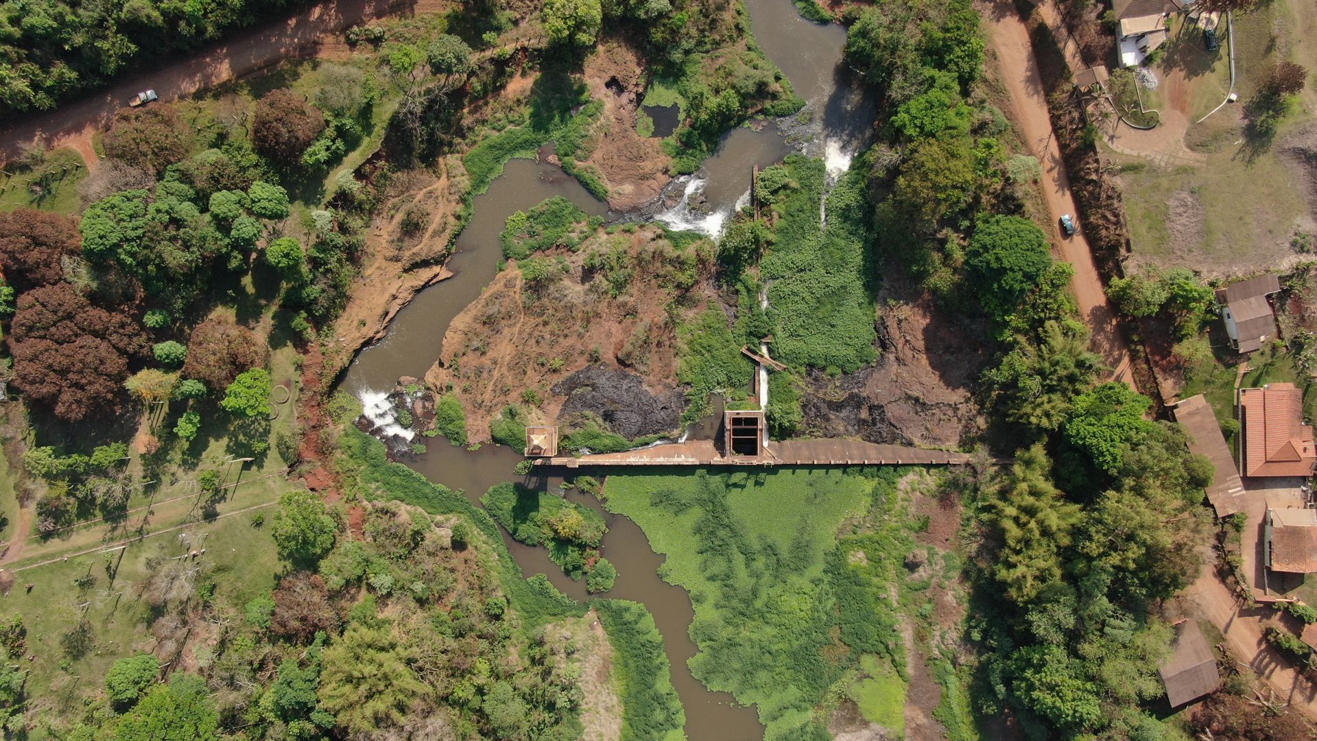 Aerial perspective of lush river landscape in Parana, Brazil featuring green vegetation and serene waterways.