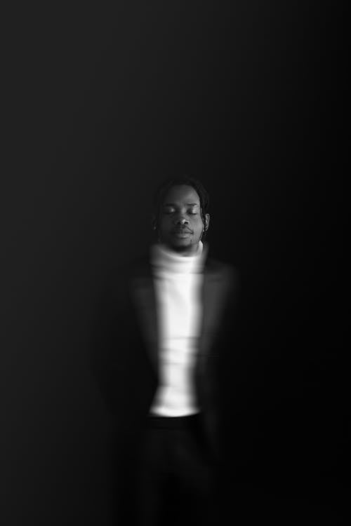 Free Black and White of a Man with Blurred Clothing Stock Photo