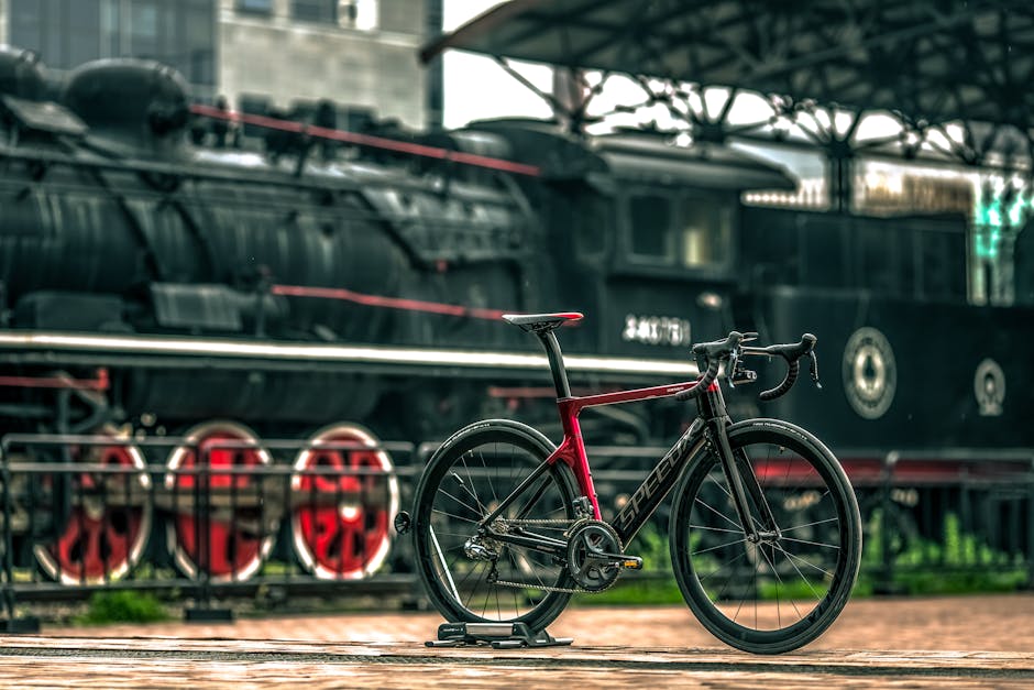 Black And Red Road Bike Near Black Train