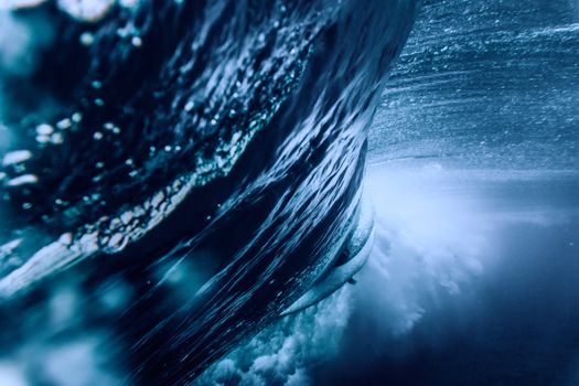 A captivating underwater shot of a powerful ocean wave in Caraga, Philippines.