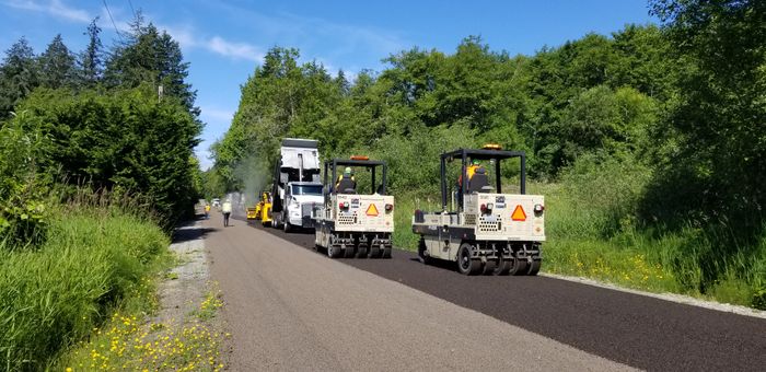 Compaction rollers finishing fresh asphalt