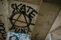 Anarchy sign painted on ceiling in building