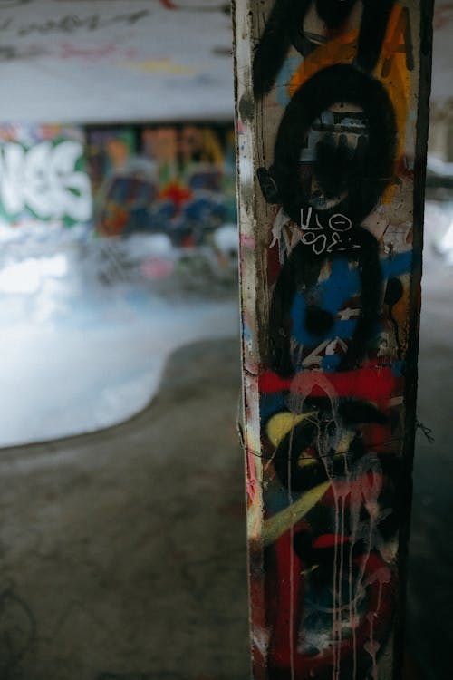 Column covered in graffiti at skatepark 