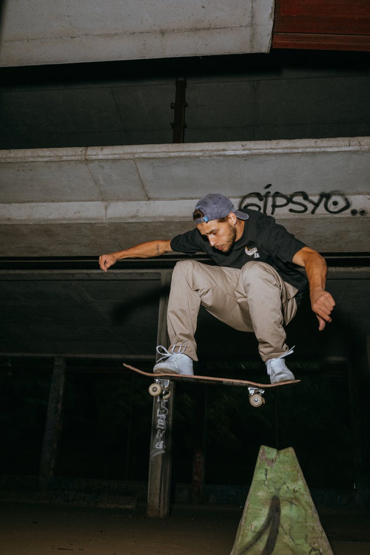 Young Man Jumping On Skateboard 