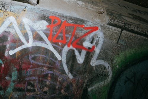 Free Rude graffiti on wall  Stock Photo