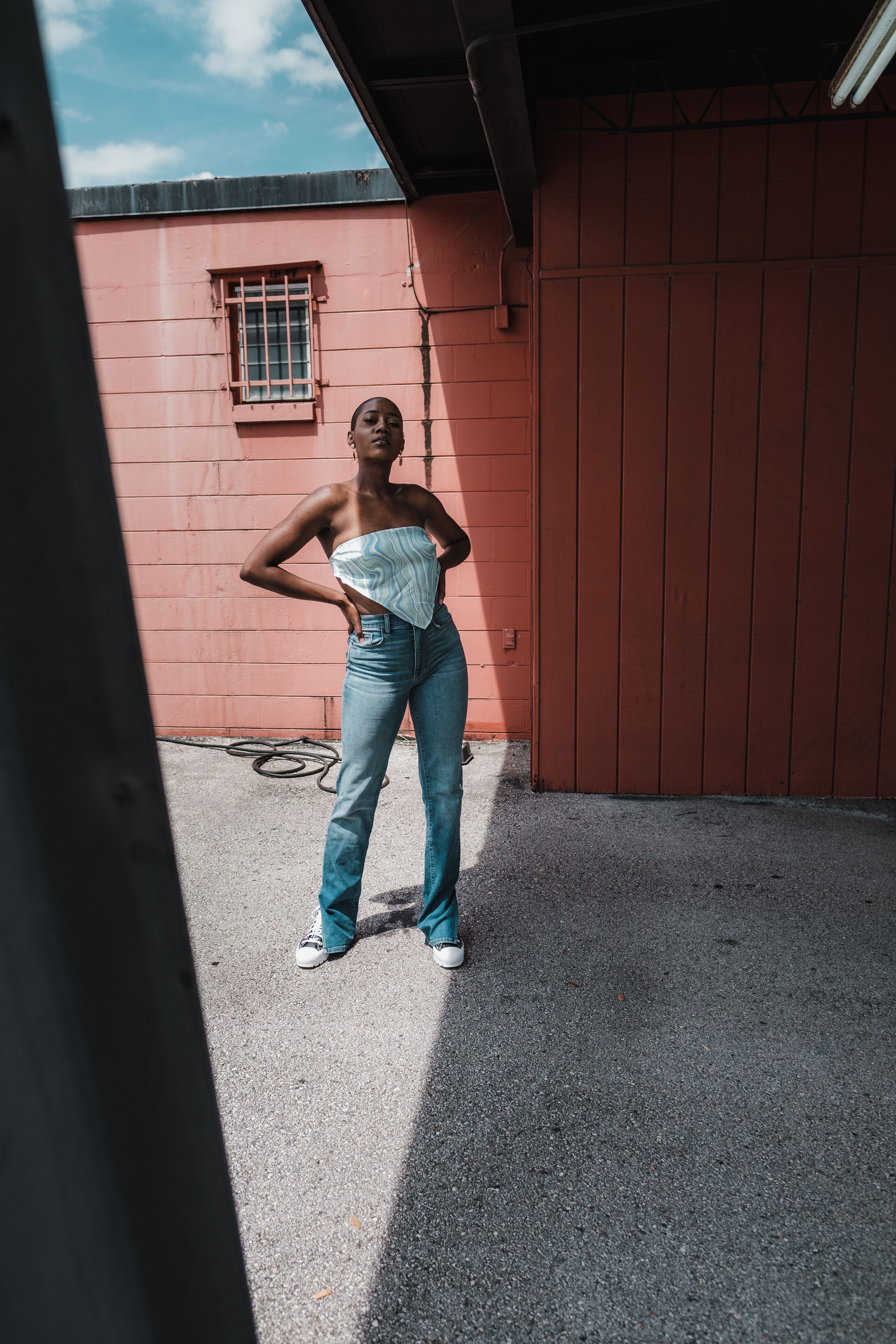 Woman in Blue Denim Jeans Posing · Free Stock Photo