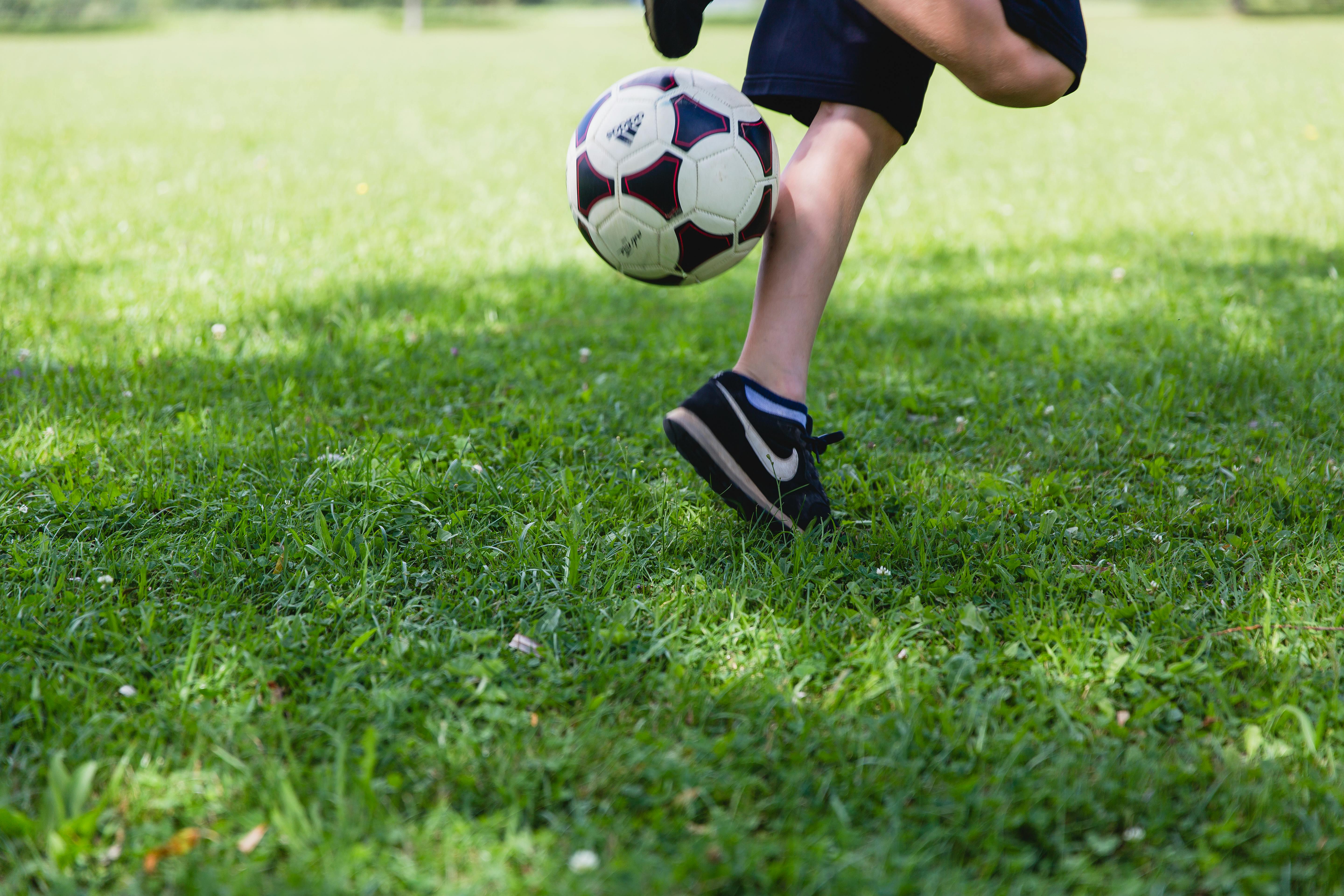 Person Wearing Black Nike Low-tops Sneakers Playing Soccer