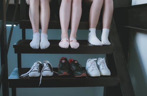 Free Three Pairs of Low-top Sneakers Stock Photo