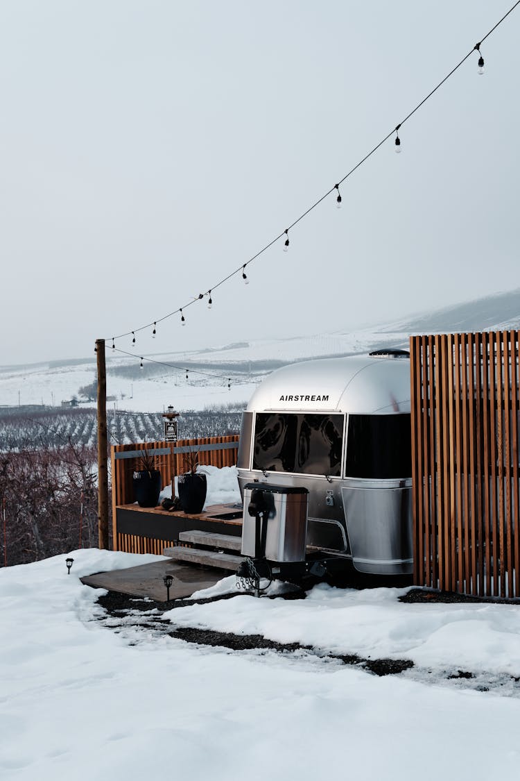 Airstream Near The Snow Covered Ground