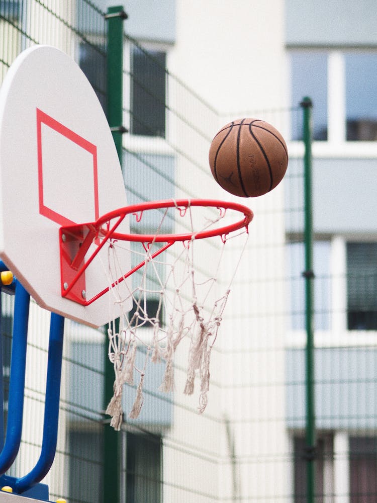 Ball Falling In Basketball Basket