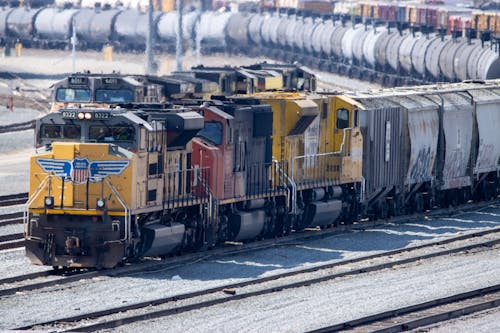 Yellow and Gray Train on Rail Tracks