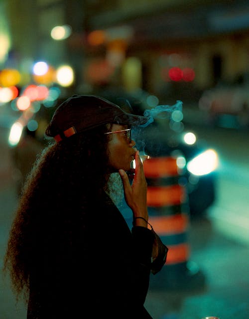 Woman Wearing Black Jacket Smoking