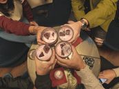 Person Holding Two Round Doughnuts