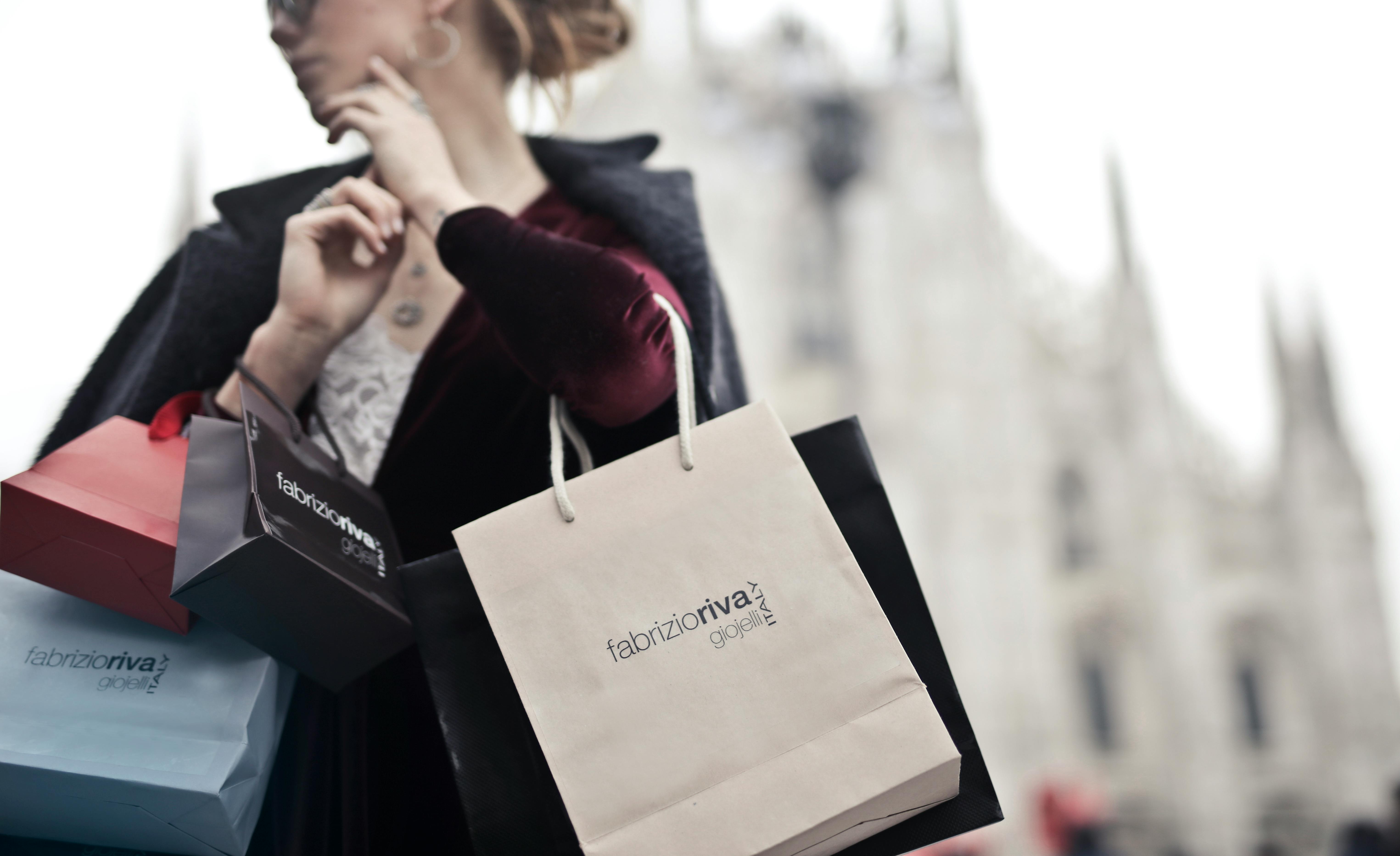 Girl holding shopping discount bags