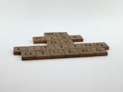 Wooden Scrabble Tiles on White Surface