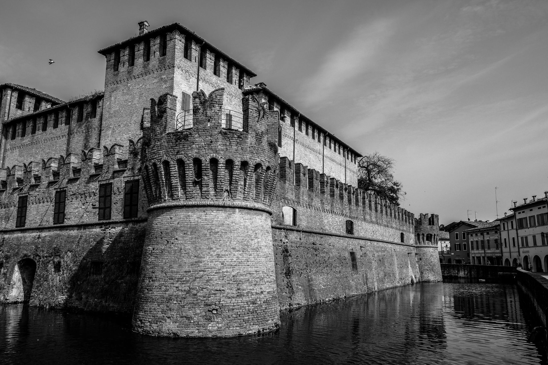 Grayscale Photography of Castle Near Body of Water