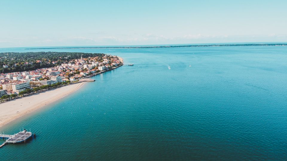 Stunning aerial view of Arcachon city and beach, showcasing the vibrant summer coastline.
