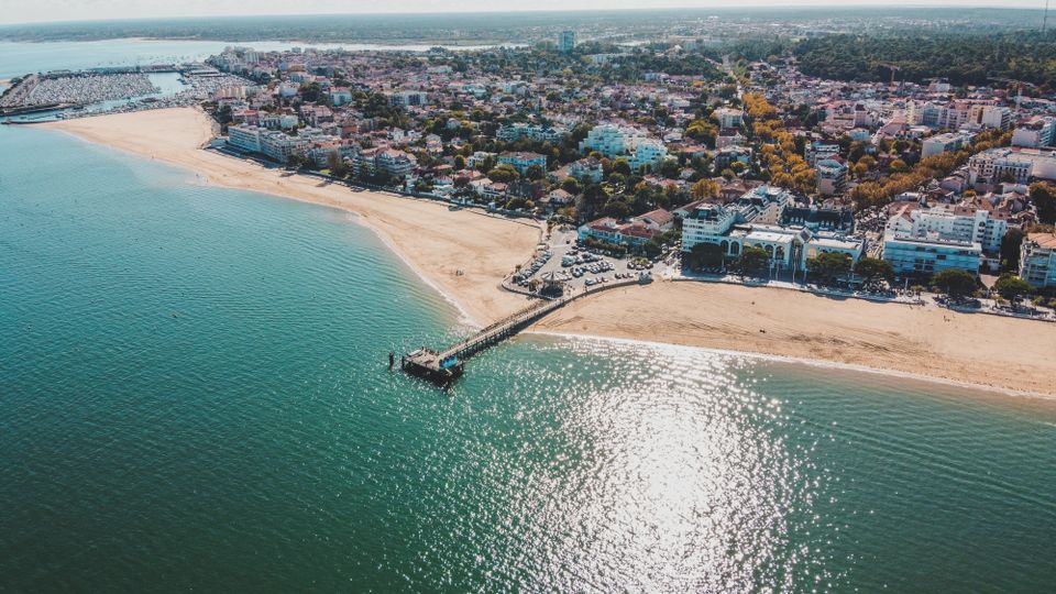 Stunning aerial view of Arcachon in Nouvelle-Aquitaine, France, highlighting the coastline and cityscape.