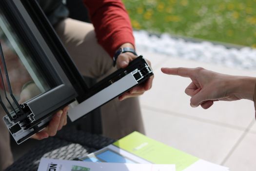 Person Holding Black and Silver Digital Device