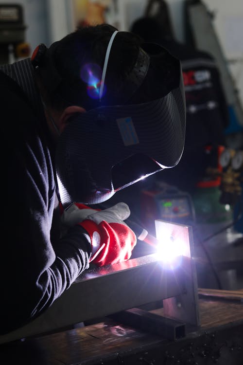 Close-up Photo of Welder doing some metal Work 