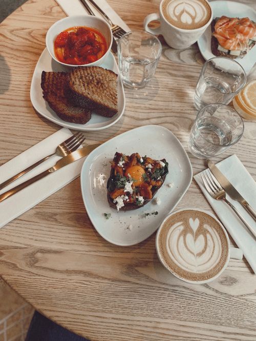 Free Top-down view of a cozy breakfast table with coffee and toast. Stock Photo