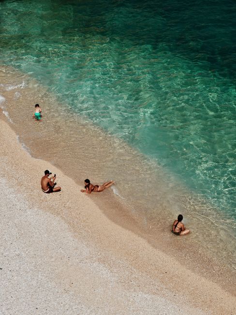 High-angle shot of people enjoying a sunny day at the beach in Finike, Antalya.