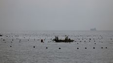 People Riding a Fishing Boat on Sea