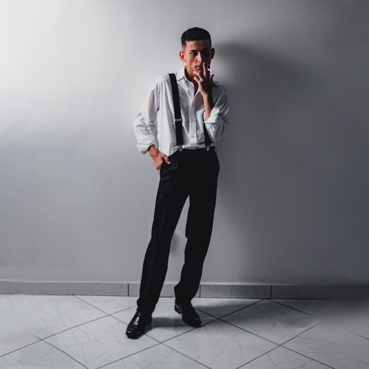 Man In Suit Smoking Cigarette Inside