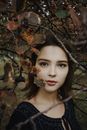 Woman Standing Under Tree Branches